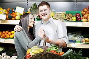 Young couple shopping at supermarket