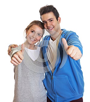 Young couple showing thumbs up