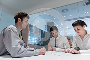 Young couple signing contract documents on partners back