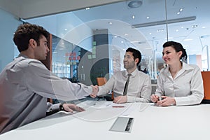 Young couple signing contract documents on partners back