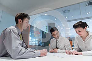 Young couple signing contract documents on partners back