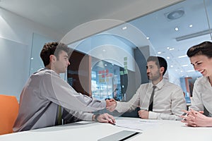 Young couple signing contract documents on partners back