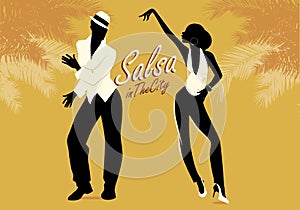 Young couple silhouettes dancing salsa or latin music. photo