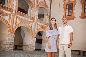 Young couple siteseeing on a hot summer afternoon on a paved street