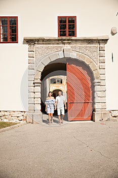 Young couple siteseeing on a hot summer afternoon on a paved street photo