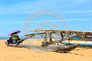 Young couple sitting at the beach