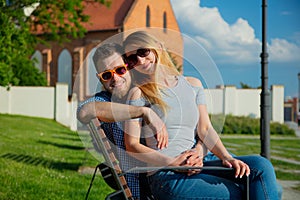 Young couple sitting on bench