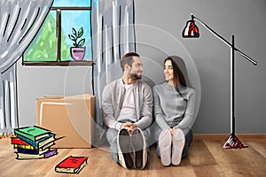 Young couple sitting on floor near box indoors and imagining interior of new house. Moving day