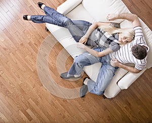 Young Couple Sitting on Love Seat