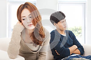 Young Couple sitting on the sofa during conflict