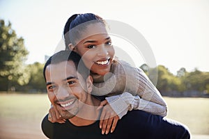 Young couple smiling at camera in Brooklyn, close up