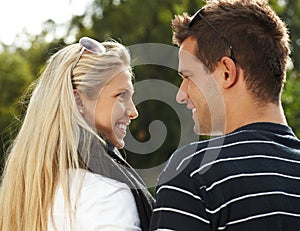 Young couple smiling outdoors