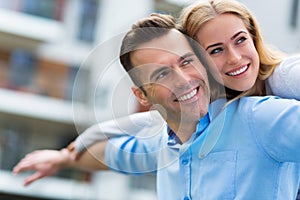 Young couple smiling outdoors