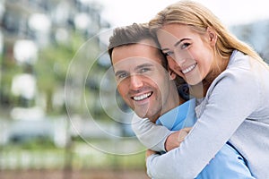 Young couple smiling outdoors