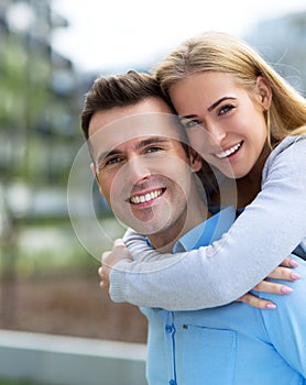 Young couple smiling outdoors