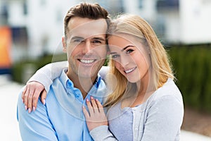 Young couple smiling outdoors