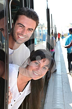 Young couple smiling in tramway