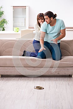 Young couple and snake in the flat