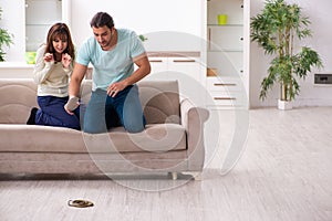 Young couple and snake in the flat