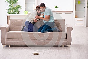 Young couple and snake in the flat photo