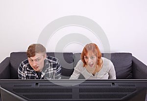 A young couple on a sofa photo