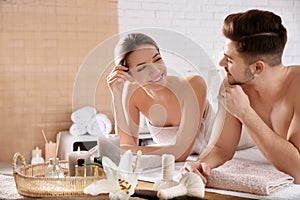 Young couple with spa essentials
