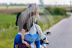 Young couple with a speed motorcycle