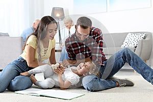 Young couple spending time with their daughter. Happy family