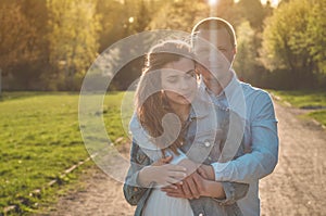 A young couple spends time together outdoors. Couple having fun summer time