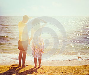 Young couple standing on the beach