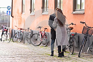 Young couple standing on a quiet urban street