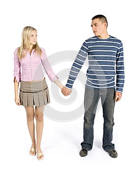 Young couple standing together looking their eyes