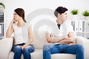 Young Couple stress and sitting on the sofa