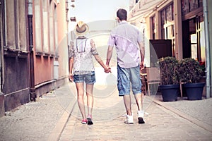 Young couple strolling about the city