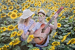 Young couple in sunflower field