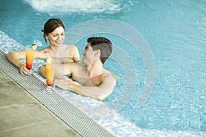 Young couple in the swimming pool
