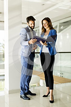 Young couple with tablet in the modern office