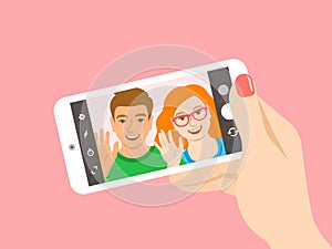 Young couple takes a selfie with a smartphone