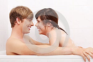 Young couple taking a bath.