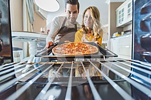 Couple with burnt pizza