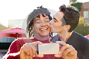 Young couple taking selfie