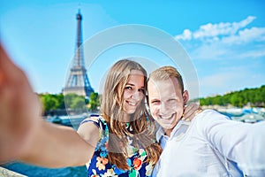 Young couple taking selfie in Paris, France