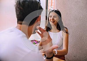 Young couple talking in coffee shop