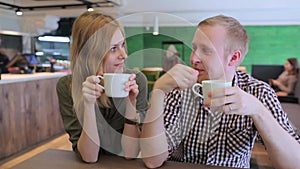 Young couple talking in coffee shop