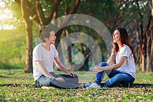 Young couple talking and laghing in park