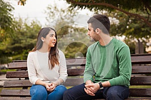 Young couple talking at a park