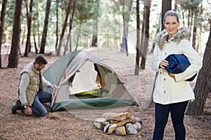 Young couple with tent in the wilderness