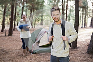 Young couple with tent in the wilderness