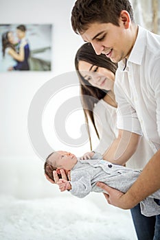 Young couple and their newborn baby boy