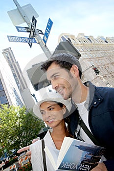 Young couple of tourists in crossroads